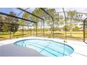 Beautiful screened-in pool offering a private backyard view at 4245 Arlington Ridge Blvd, Leesburg, FL 34748