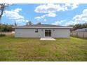 Expansive backyard featuring lush lawn and a patio area perfect for outdoor entertaining and relaxation at 3590 Sw 150Th Ct, Ocala, FL 34481