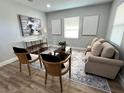 Cozy living room featuring neutral tones, a stylish rug, and comfortable seating at 709 N Lincoln Ave, Lakeland, FL 33815