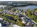 Beautiful aerial view of home in a waterfront community with lush landscaping and lake views at 772 Stephens Pass Cv, Lake Mary, FL 32746