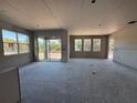 Spacious living room area with large windows providing ample natural light and views at 1169 Basalt Ln, Sanford, FL 32771