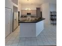 Kitchen features a large island and ample cabinetry at 1833 Queen Palm Dr, Apopka, FL 32712