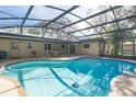 Relaxing screened in pool area with covered lanai, perfect for outdoor entertaining at 33629 Wesley Rd, Eustis, FL 32736