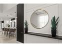 Stylish entryway featuring a decorative mirror, plants, and modern design elements at 3955 Lana Ave, Davenport, FL 33897
