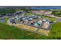 Aerial view of a new housing development, showing various stages of construction and completed homes at 438 Belmond Dr, Debary, FL 32713