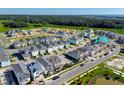 Aerial view of a new home community, showcasing houses under construction and completed homes at 438 Belmond Dr, Debary, FL 32713