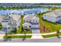 Beautiful two-story home featuring a well-manicured lawn and elegant gray stone driveway at 11357 Satire St, Orlando, FL 32832