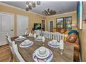 Dining area with seating for eight, with view into living room at 912 Charo Pkwy # 223, Davenport, FL 33897