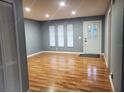Bright living room with wood floors and neutral walls at 16 N Lancelot Ave, Orlando, FL 32835