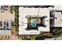 Apartment complex with central courtyard pool, landscaping, and parking on the property at 202 E South St # 6042, Orlando, FL 32801