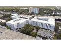 Multi-Gathering complex with parking and a traditional architectural style with arched window details at 202 E South St # 6042, Orlando, FL 32801