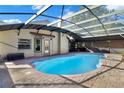 Inviting pool area with covered patio and brick pavers at 2711 Ambrosia Ct, Apopka, FL 32703