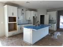 Modern kitchen featuring white shaker cabinets and an island at 1366 Twelve Oaks Rd, Saint Cloud, FL 34771