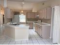 Bright kitchen with light wood cabinets and tile flooring at 267 Tinder Pl, Casselberry, FL 32707