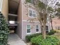 Apartment exterior view with walkway and well-maintained landscaping at 3468 Soho St # 107, Orlando, FL 32835