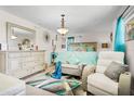 A bright and airy main bedroom features a large bed, stylish furniture, and contemporary decor at 1407 Edgewater Beach Dr, Lakeland, FL 33805