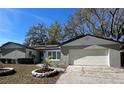 Charming single-story home with a well-maintained lawn and flower beds beneath a clear blue sky at 642 Wheeling Ave, Altamonte Springs, FL 32714
