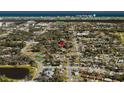 Panoramic aerial view of the neighborhood showcasing lush greenery, nearby parks, and proximity to the ocean at 841 Vernon St, Daytona Beach, FL 32114