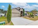 Two-story house with attached garage and nicely landscaped front yard at 171 Pheasant Dr, Haines City, FL 33844