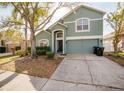 Traditional two-story home boasts a manicured front yard and a two car garage at 2142 Brandywine Falls Way, Orlando, FL 32824