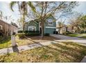 Charming home featuring mature landscaping, well kept lawn, and a two-car garage at 2142 Brandywine Falls Way, Orlando, FL 32824