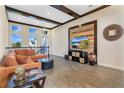 Spacious living room with high ceilings, large sectional sofa, and a rustic wood feature wall at 13471 Granger Rd, Orlando, FL 32827