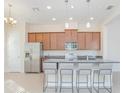 Beautiful Kitchen with granite countertops, stainless steel appliances, and an island with bar seating at 14046 Walcott Ave, Orlando, FL 32827
