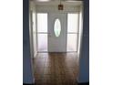 Inviting entryway with tiled floor and glass-paned door at 1575 Guinevere Dr, Casselberry, FL 32707