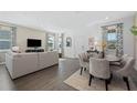 Bright dining area with a round table and gray upholstered chairs at 434 Belmond Dr, Debary, FL 32713