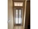 Interior view of front door with blinds at 10065 Lake District Ln, Orlando, FL 32832