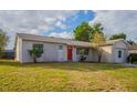 Newly renovated home with stone accents and a well-maintained lawn at 4533 San Sebastian Cir, Orlando, FL 32808