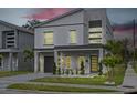 Beautifully designed two-story home with modern architectural details and landscaped front yard at dusk at 801 W Anderson St, Orlando, FL 32805
