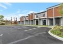 Modern townhome with sleek exteriors, highlighted by the well-maintained landscaping and convenient parking at 3245 Sustainable Way, Kissimmee, FL 34747