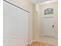 Bright entryway with tile flooring and a coat closet at 2871 Sandy Cay St, Clermont, FL 34711