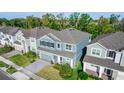 Beautiful two-story home boasting a well-manicured lawn, gray roof, and desirable neighborhood at 5648 Green Arrow Pl, Sanford, FL 32773