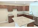 Modern kitchen with granite countertops and ample cabinetry at 6921 Central Ave, Mulberry, FL 33860