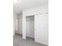 Bedroom with a spacious closet and gray carpeting at 5166 Minneola Ln, Saint Cloud, FL 34772