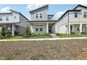 Attractive two-story home with modern design, covered porch, and neat landscaping at 5015 Railroad Vine Aly, Winter Garden, FL 34787