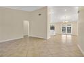 Open concept living area with views to kitchen and dining areas at 3629 Peaceful Pl, Orlando, FL 32810