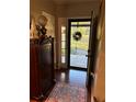 Bright and spacious entryway with hardwood floors and charming decor at 12680 Sw 98Th St, Dunnellon, FL 34432