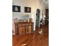 Living room featuring hardwood floors and a cozy atmosphere at 12680 Sw 98Th St, Dunnellon, FL 34432