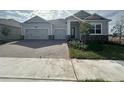 Charming single-Gathering home with a brick driveway and two-car garage at 5379 Park Guell St, St Cloud, FL 34771
