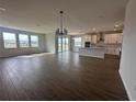 Spacious living room with hardwood floors and sliding glass doors at 5379 Park Guell St, St Cloud, FL 34771