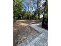 Large backyard with a partially paved patio area at 101 S Glenwood Ave, Orlando, FL 32803