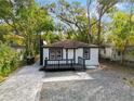 Newly renovated home with a modern deck and landscaped yard at 101 S Glenwood Ave, Orlando, FL 32803