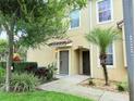 Up close view of a front entrance showcasing a quaint walkway and well-manicured garden at 2856 Oakwater Dr # 2856, Kissimmee, FL 34747