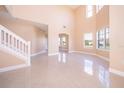 Spacious living room with high ceilings and tile floors at 51 Andora Ct, Kissimmee, FL 34758