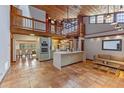Open kitchen features exposed-beam ceilings, an island, and stainless steel appliances at 360 Rest Haven Rd, Geneva, FL 32732
