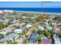 Aerial view highlighting the home's convenient location to the beach at 110 Surf St, New Smyrna Beach, FL 32169