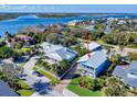 Aerial view showing a charming beach house and its proximity to the water at 110 Surf St, New Smyrna Beach, FL 32169